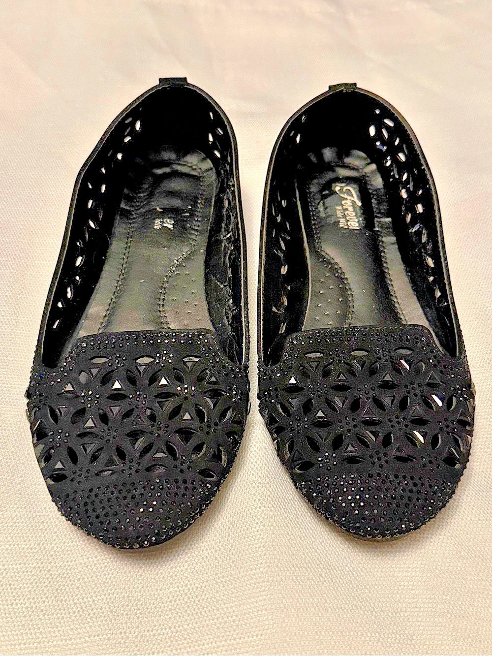 Forever Comfort Shoes | Black Laser-Cut Slip-On Loafers With Rhinestone Detail